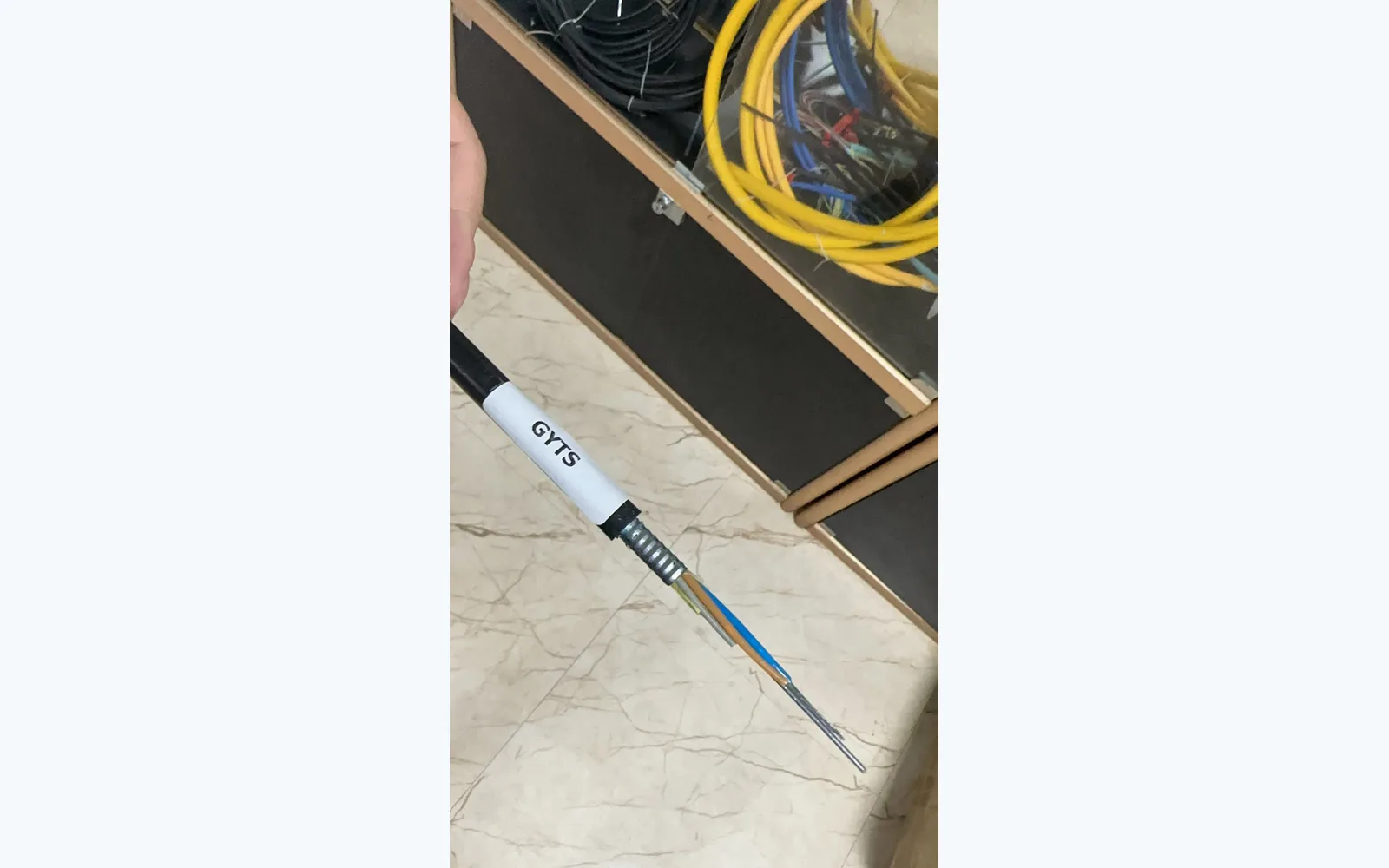 GYTS cable construction sample with exposed coloured tubes from the local product collection, illustrating identification layers rather than an approved fibre colour sequence